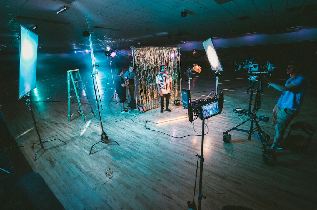 Broadcast control room with multiple video monitors and live feeds