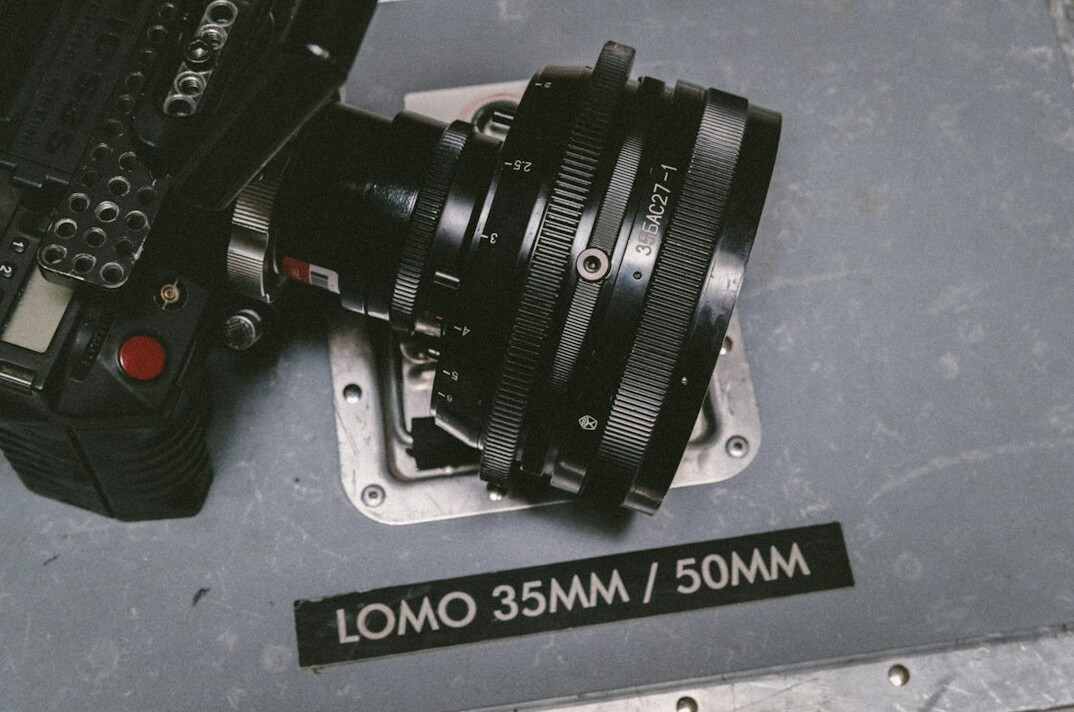 Close-up of a professional broadcast camera rig and lens